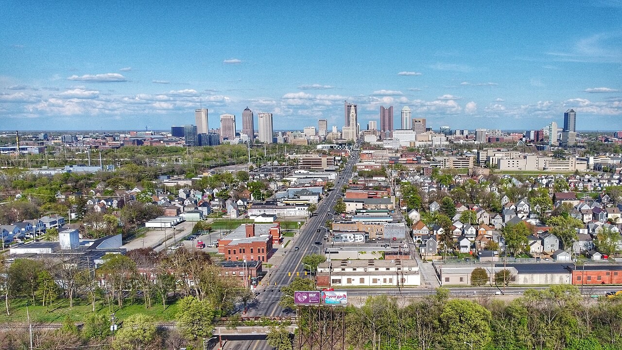 Elevated view of West Broad Street corridor in Franklinton heading east towards downtown Columbus skyline.