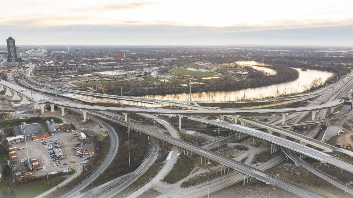 High aerial view of multi-level highway flyover ramps under construction near the Scioto River in Columbus, Ohio.