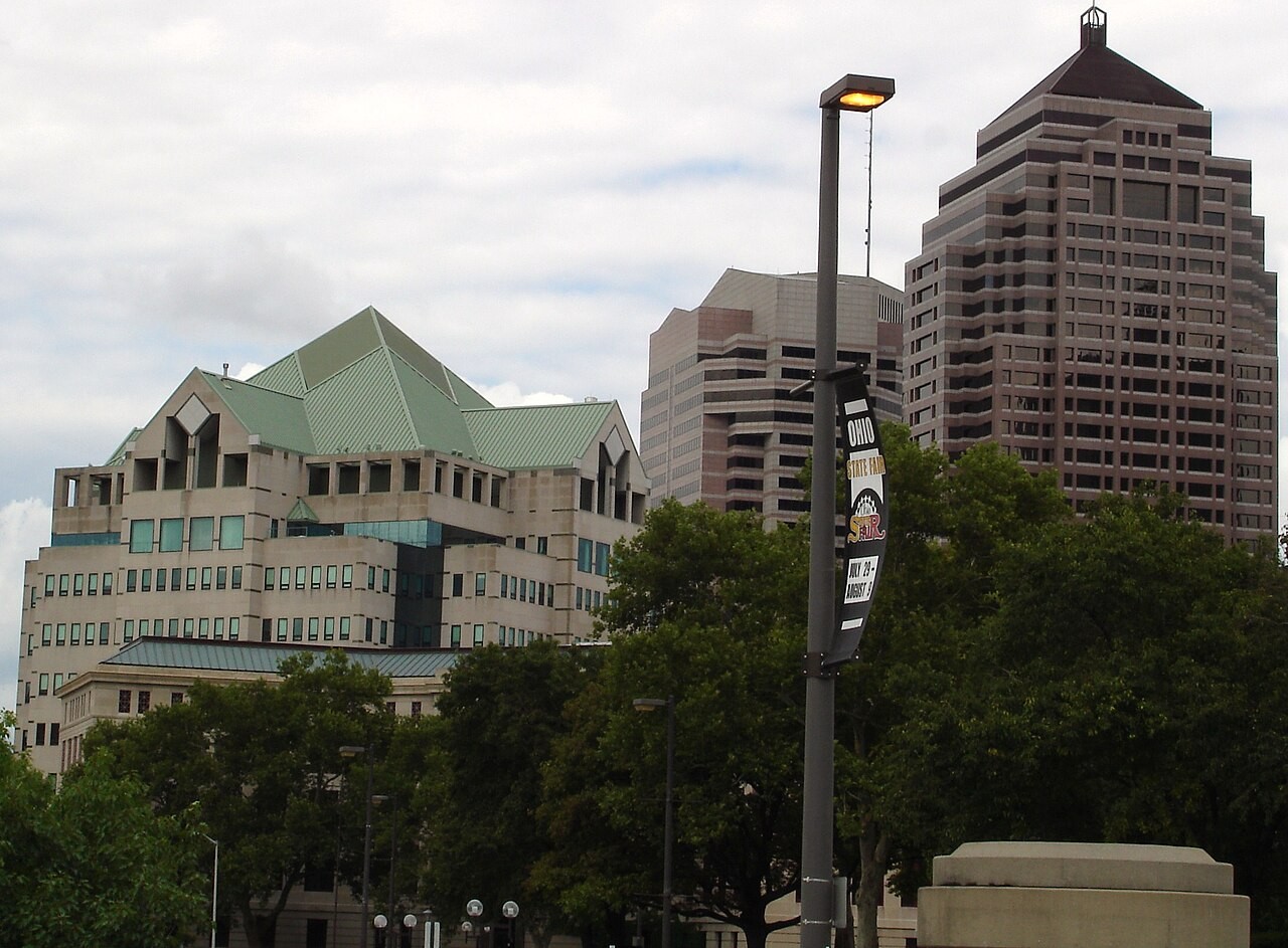 Exterior view of the Columbus Division of Police Headquarters building with its distinct green pitched roof in downtown Columbus.